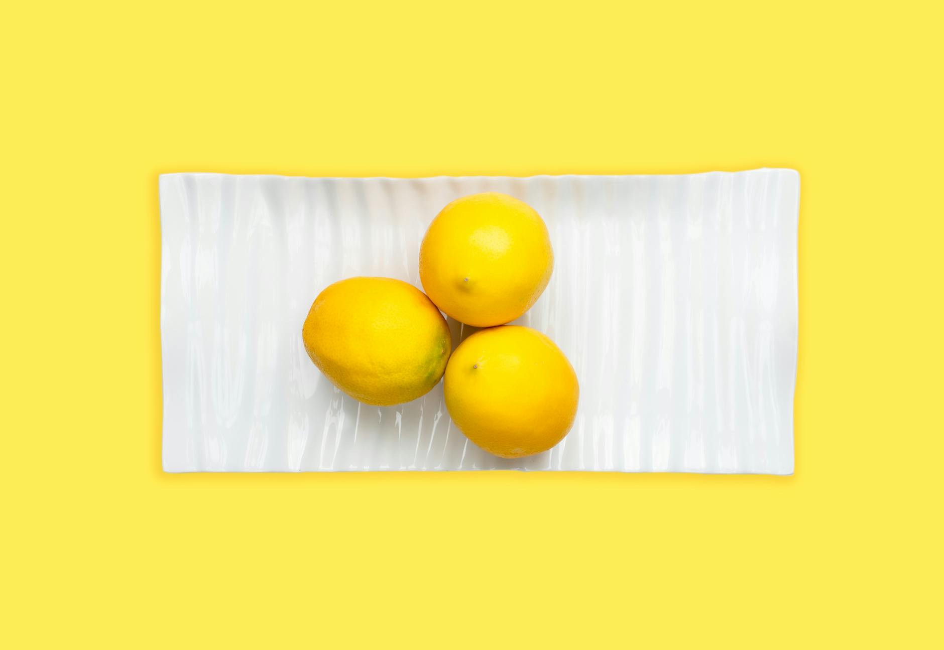 Person holding lemon clitoral vibrators ready to explore solo pleasure
